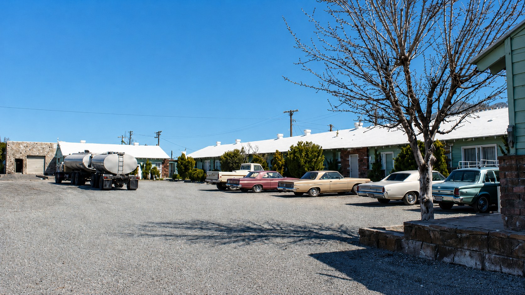 Pop's Oasis motel units with vintage cars